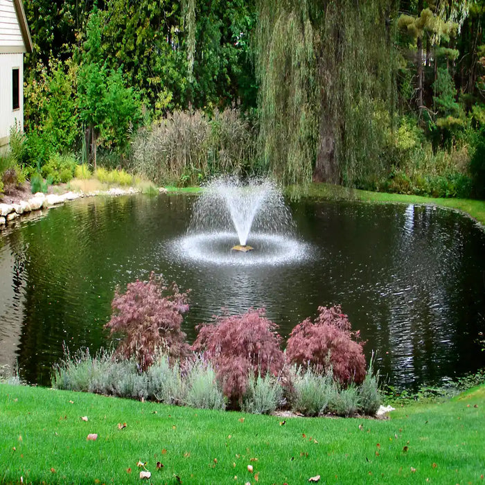 scott_aerator_da_20_pond_fountain_aerator_in_water_with_trees_and_building_in_background