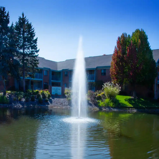 scott_aerator_gusher_pond_fountain_in_pond_with_building_in_background