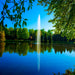 scott_aerator_gusher_pond_fountain_in_water_with_trees_in_background