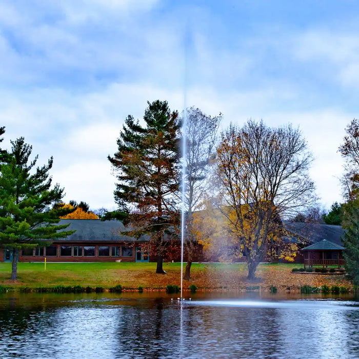 scott_aerator_jet_stream_pond_fountain_in_water_with_building_and_trees_in_background